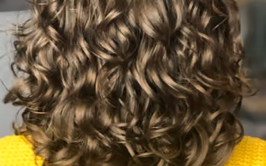 Client with defined curls after a curly cut at Strand and Lock in Digbeth