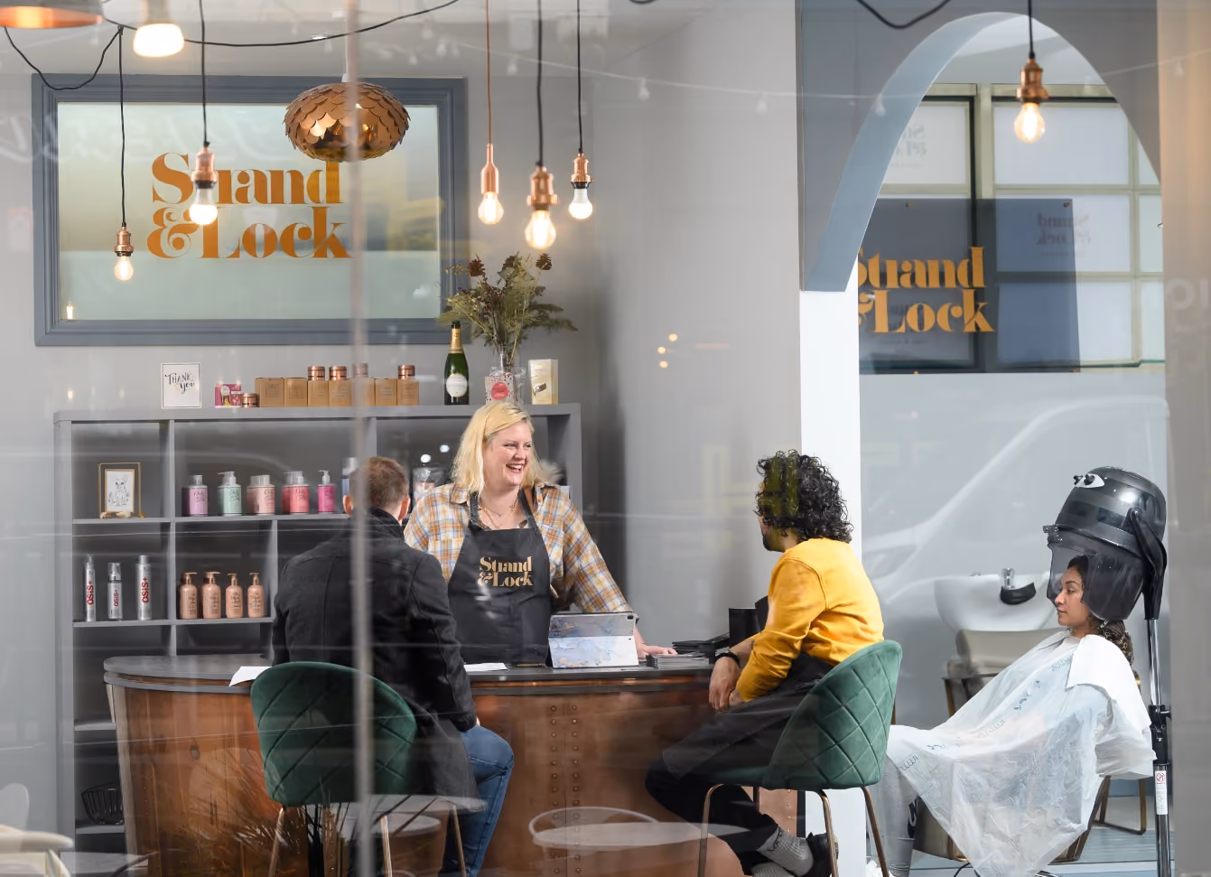 Stylists welcoming clients at the Strand and Lock salon