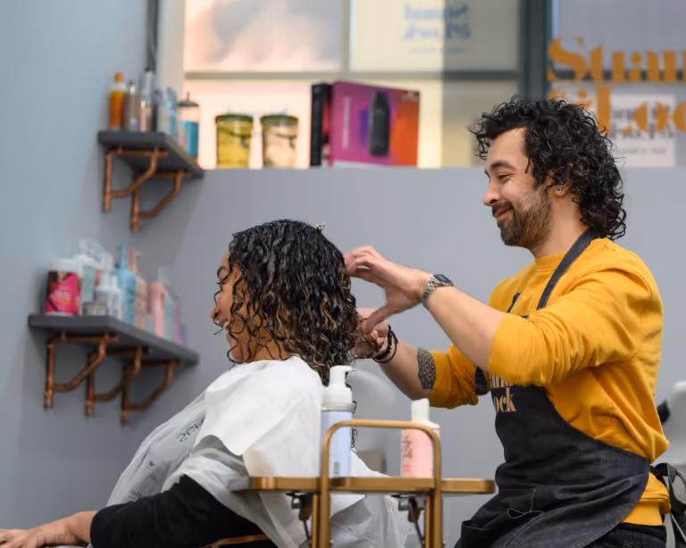 Curl cutting in progress, shaped dry, styled to bounce.